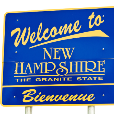 Welcome to New Hampshire sign featuring "The Granite State" and "Bienvenue."