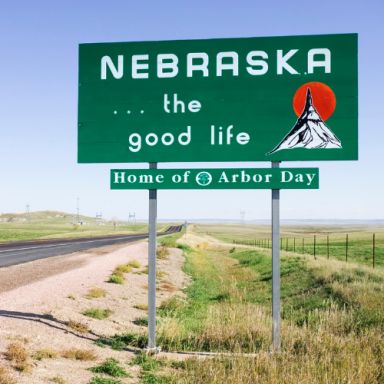 Sign welcoming visitors to Nebraska, highlighting "the good life" and Arbor Day.